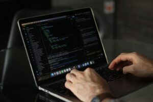 Developer coding on laptop using AI tools for D2C business India