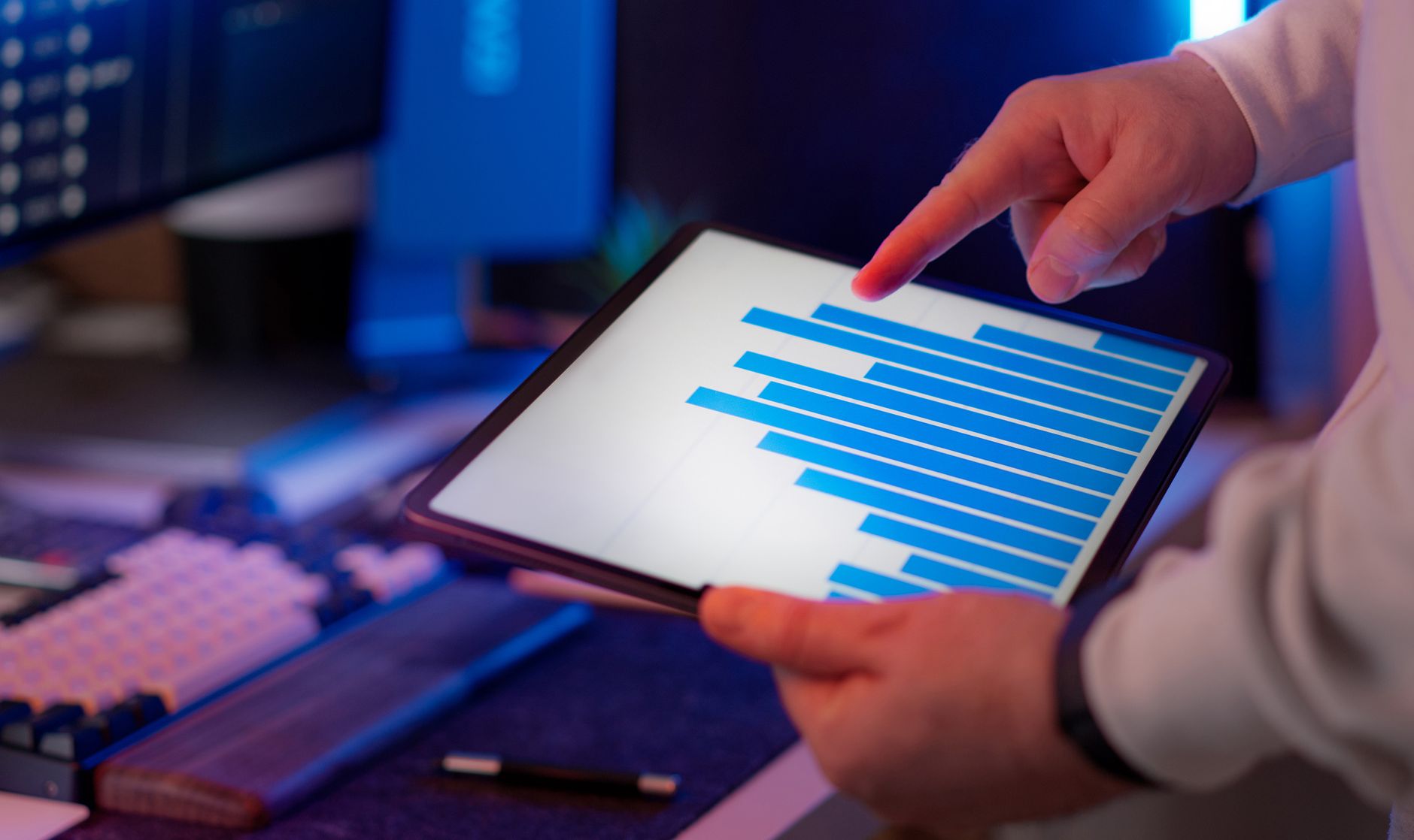 Business professional analyzing CRO data and conversion metrics on tablet