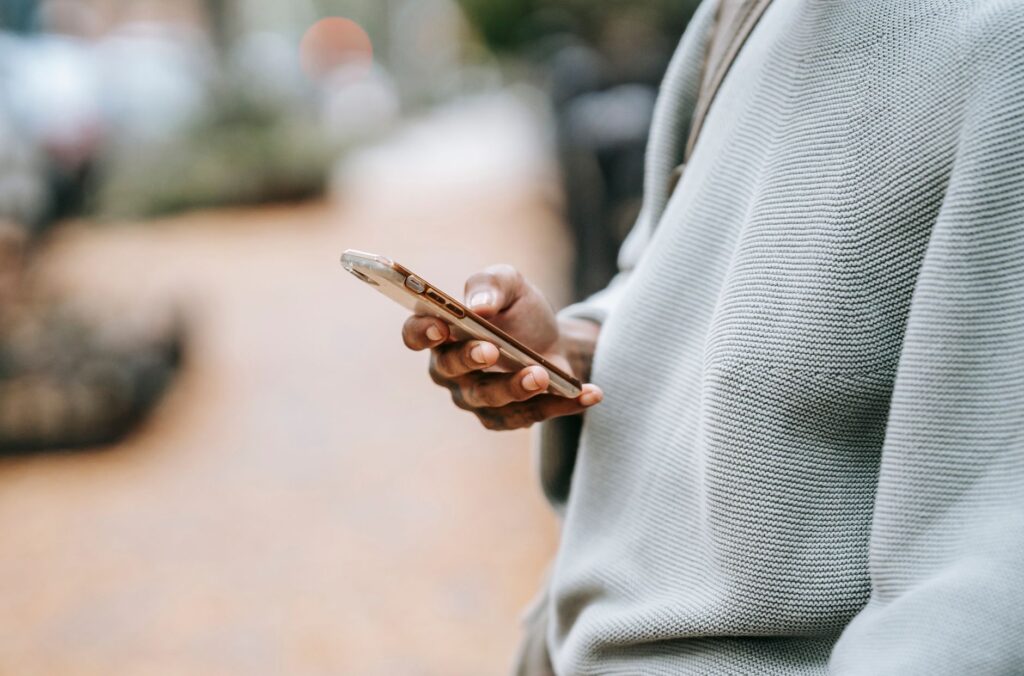 SMS marketing strategy for D2C brands in India - person using mobile phone