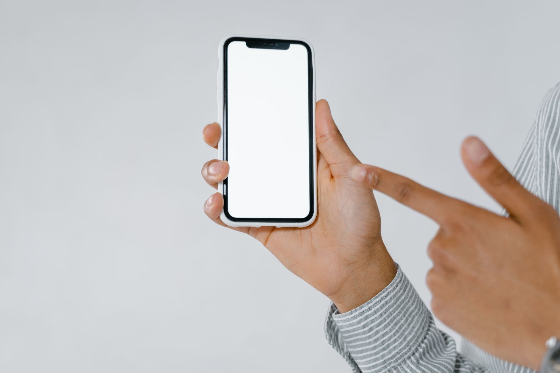Person holding smartphone — loyalty rewards notifications for D2C brand India